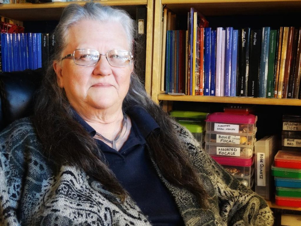 picture of Gretchen Schork in front of bookshelf